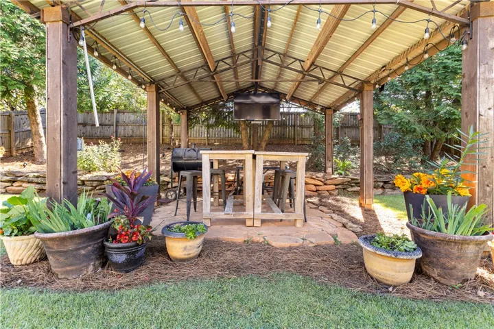 Pergola with gas hookups and power for lights and tv, tables included