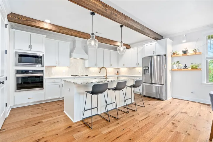 Stunning open concept kitchen with white cabinents