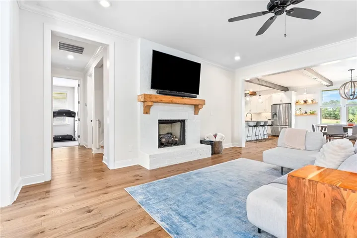 Open concept living room with a cozy fireplace