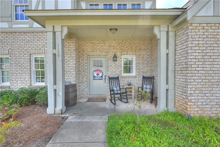 Cute & welcoming covered front porch