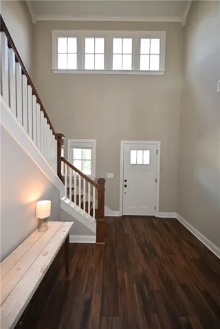 Two story foyer with lots of windows providing natural lighting!