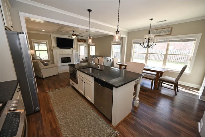 Kitchen with stainless steel appliances, gas stove, large center island