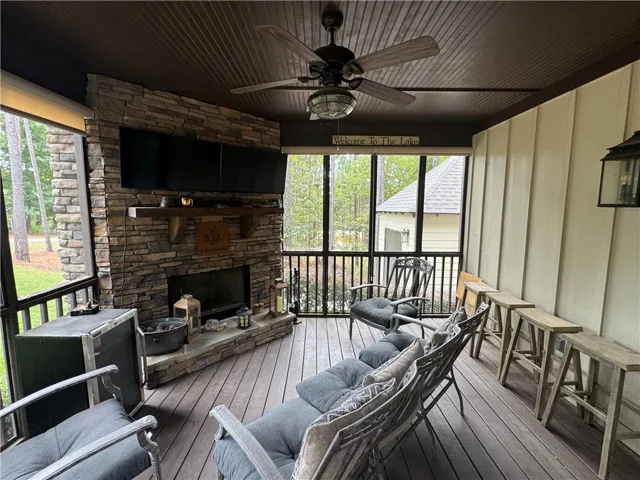 Screened in front porch with fireplace