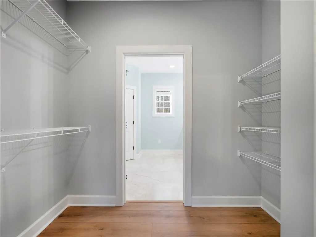 Primary closet leading to bath