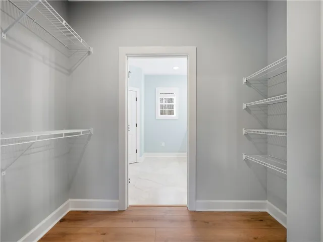 Primary closet leading to bath