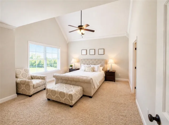 This spacious bedroom features vaulted ceilings and ample natural light, creating an inviting retreat.
