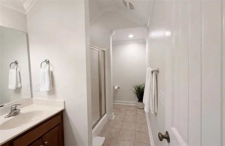 Bright and clean, this bathroom offers a functional layout and tiled floors.