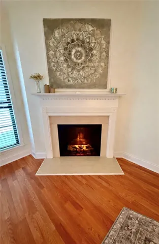 This inviting fireplace creates a focal point, perfect for gatherings or quiet evenings.