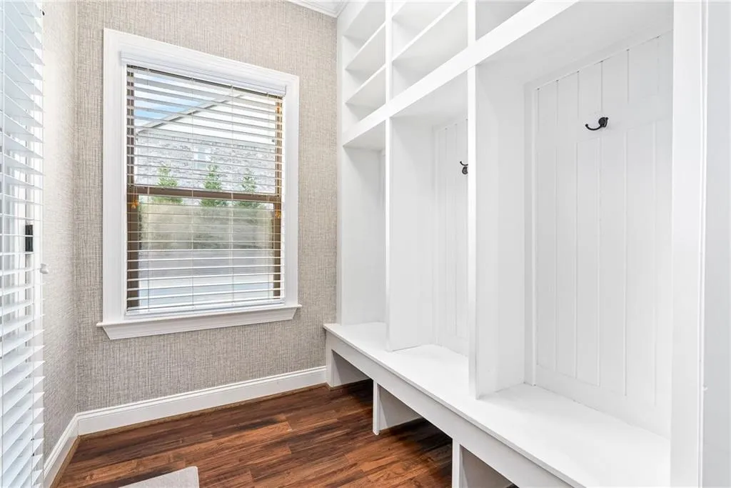 Built-in shelving and bench seating provide practical storage and a welcoming entry.