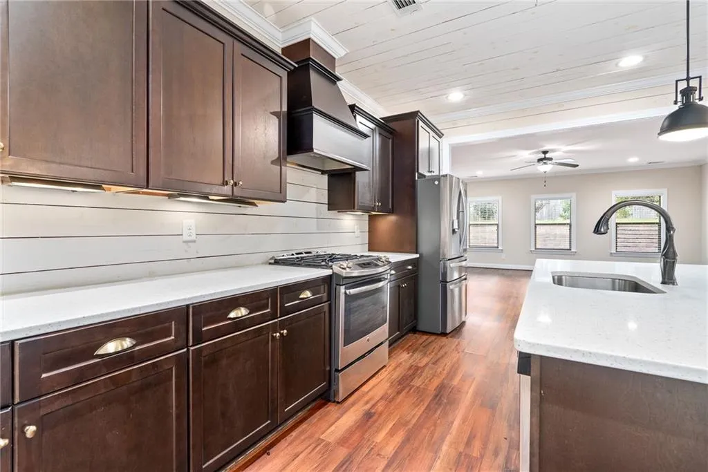 Culinary dreams come alive in this kitchen, featuring sleek stainless steel appliances and ample counter space.