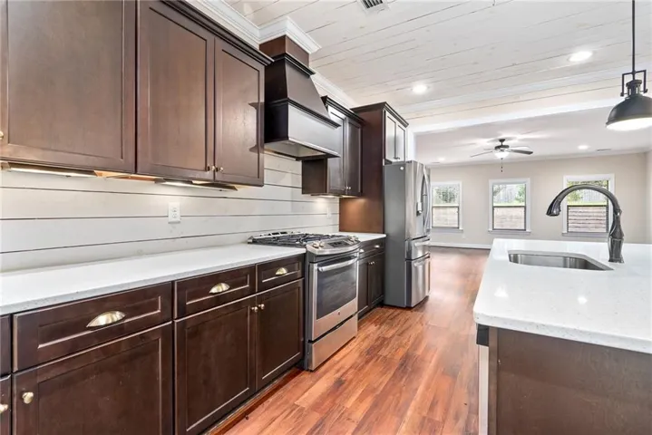 Culinary dreams come alive in this kitchen, featuring sleek stainless steel appliances and ample counter space.