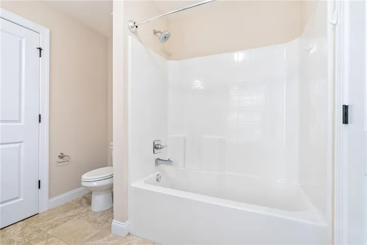 A well-appointed bathroom features an integrated shower and tub unit.