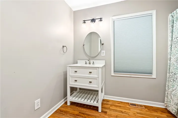 Updated vanity and Lighting in 2nd bath. Roomy and plenty of room for a vanity table or more storage.