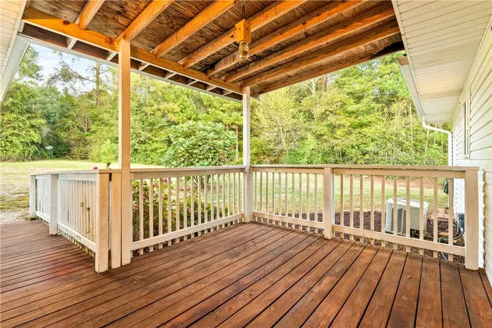 Private back porch for the apartment overlooks the beautiful level backyard. NO STEPS!!!!!