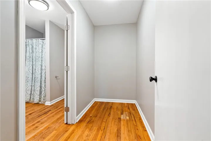 2nd bath in main house with updated fixtures. A large storage/flex area adjoins this bath and hallway. Perfect for an office or reading nook or even extra storage!