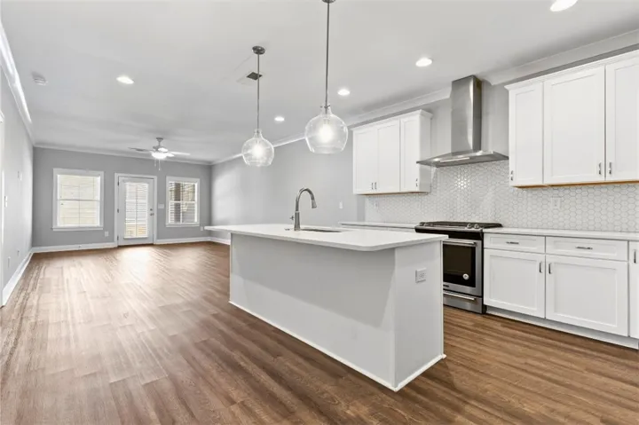 Chef's kitchen with gas stove and quartz counters