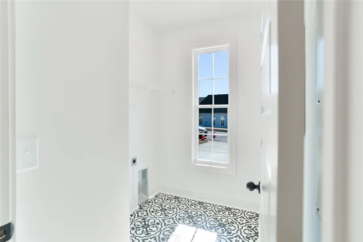 The Telford plan by Holland Homes LLC. This is a previously built home and is not the subject property.