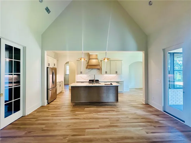 Culinary aspirations meet design in this well-appointed kitchen, flowing seamlessly into the great room.