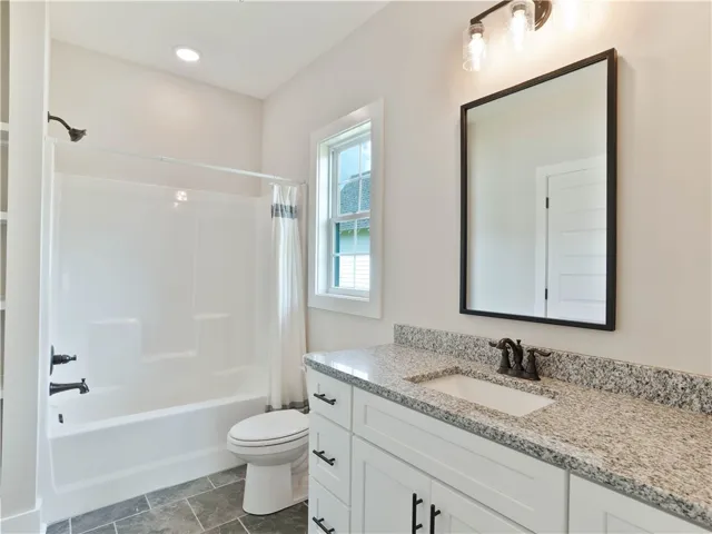 Primary Bathroom Granite Vanity Countertop - Shower/Tub Combo - example of a completed Torbert Plan