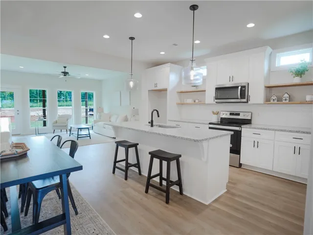 Kitchen & Dining Area with exposed shelving - example of a completed Torbert Plan