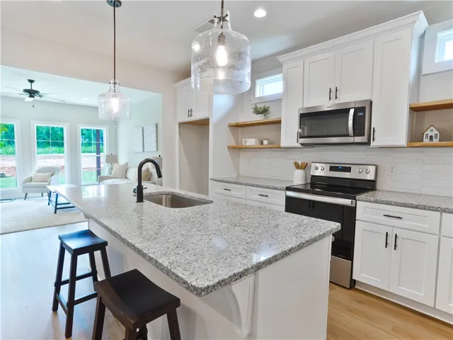 Granite countertops & Delta Plumbing Fixtures - Refrigerator in home will be included* - example of a completed Torbert Plan