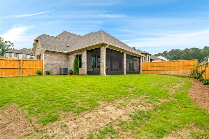 This residence features a large backyard, perfect for outdoor activities and relaxation.