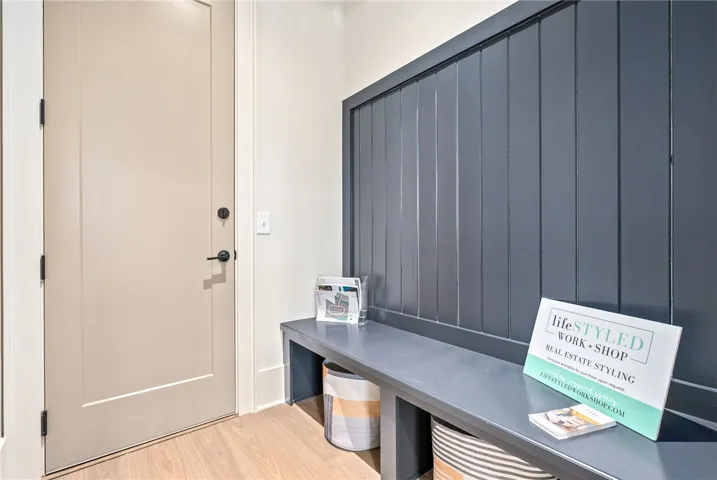 This inviting Owners entryway offers a practical bench and durable flooring.