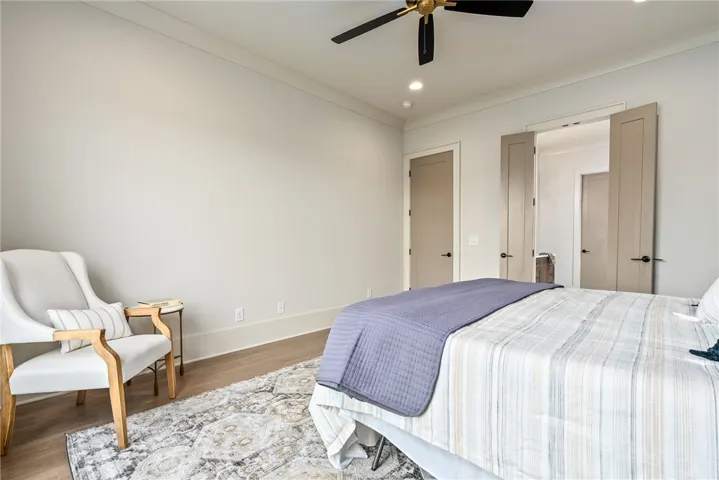 This spacious bedroom offers comfortable living with ample natural light.