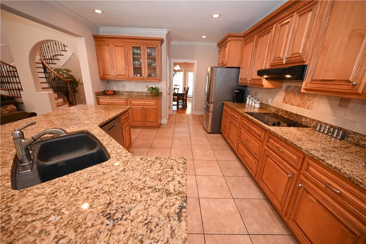 Stainless steel appliances and electric cook top.