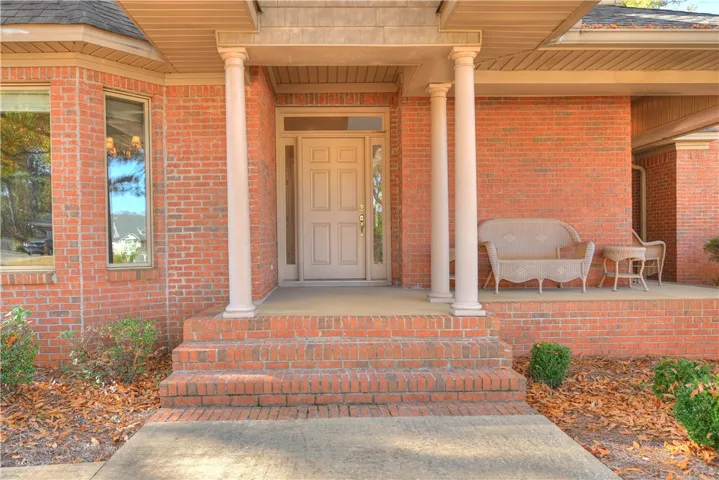 The columned entrance with a cozy covered porch invites you in!