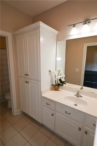 Storage filled guest bathroom.