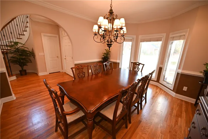 finished with a beautiful chandelier and large windows.