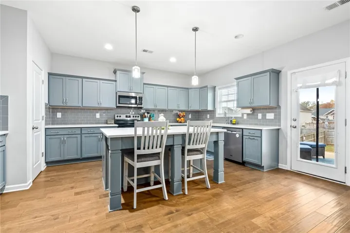 Kitchen with ample cabinetry and bar seating