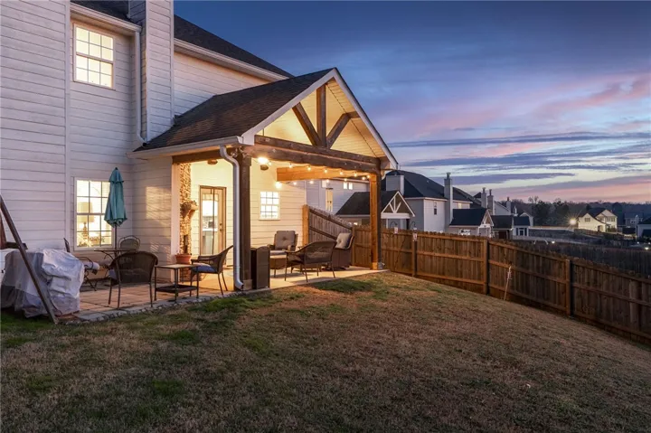 Covered back porch with wood burning fireplace