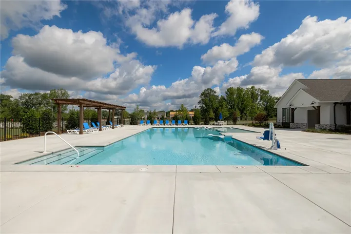 This inviting community pool offers a refreshing escape with ample space for relaxation.