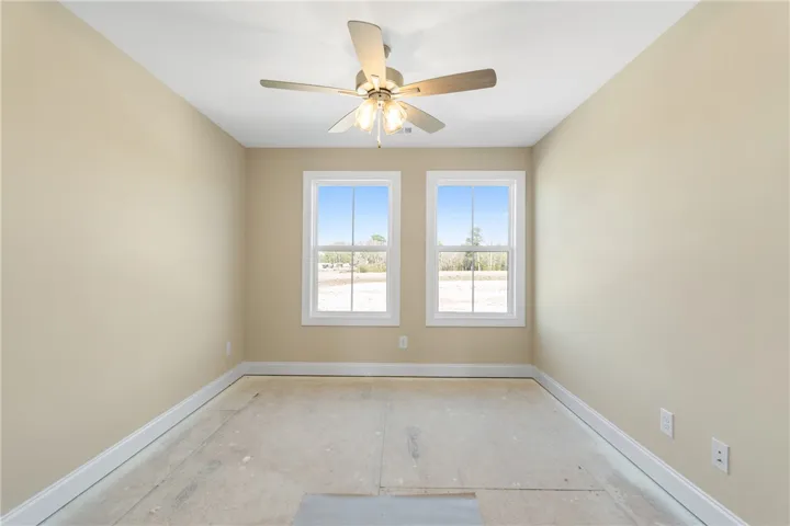 This airy room offers ample natural light and a ready canvas for your personal touch.