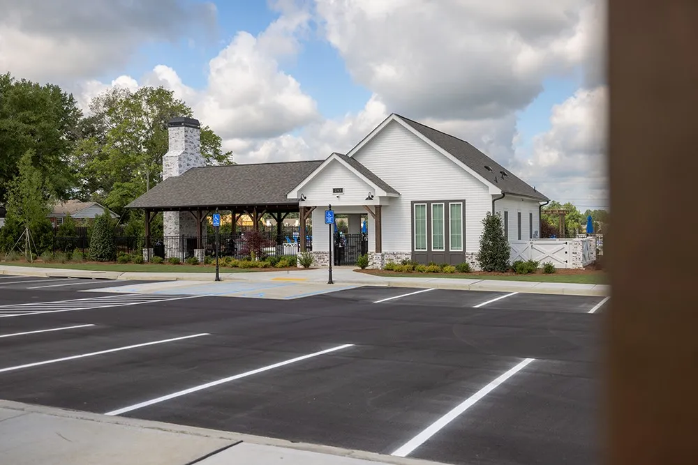 This facility features a classic architectural style, complemented by ample parking and lush landscaping.