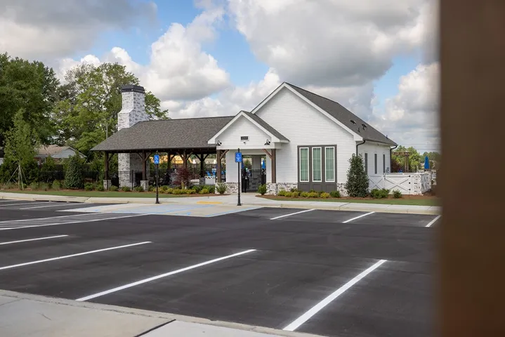 This facility features a classic architectural style, complemented by ample parking and lush landscaping.