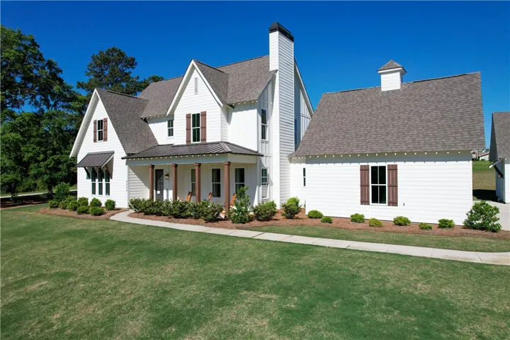 This charming home offers classic architectural details and an inviting facade, perfect for serene living.