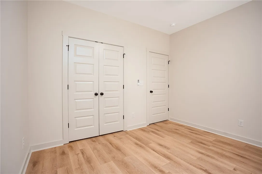 Gleaming hardwood floors and classic paneled doors define this versatile interior space.
