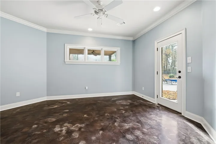 Downstairs bedroom with ensuite and pool deck access