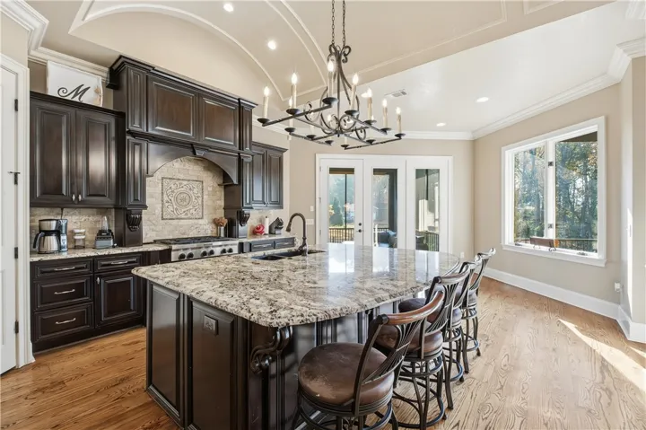 Barrel ceiling and oversized island with additional seating for entertaining