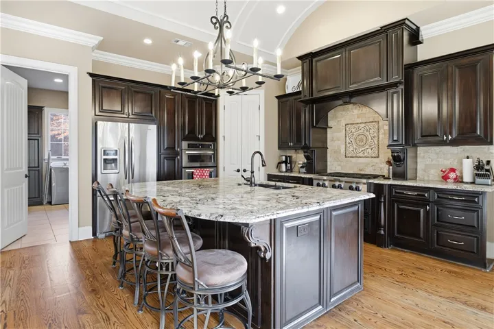 Gorgeous kitchen with barrel ceiling, VanNostrand cabinetry, gas cooktop and more!