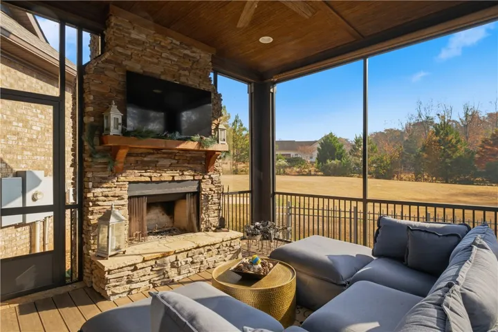 Screened in porch with wood burning fireplace