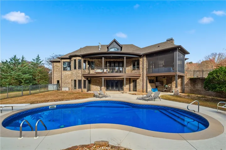 Rear elevation with Cool Decking pool coating around pool