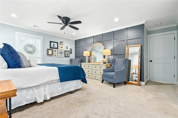 Primary bedroom with accent wall