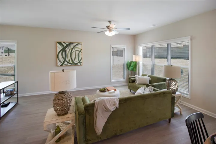 This bright living space features abundant natural light and durable flooring, perfect for comfortable daily living.