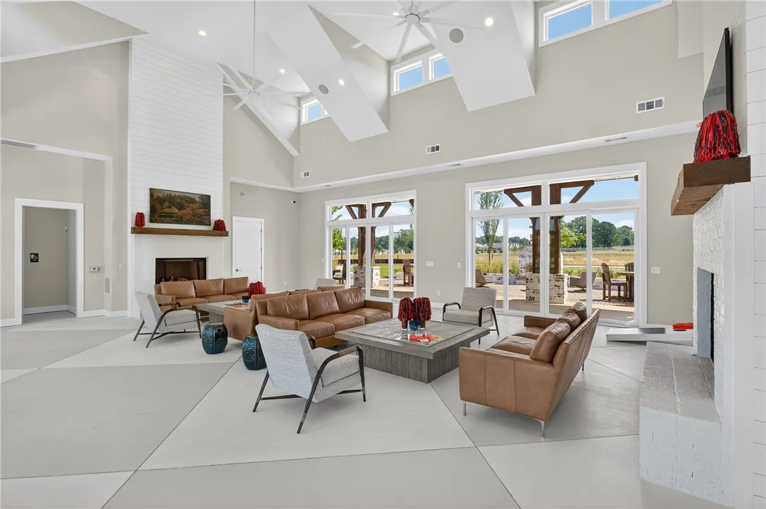 This expansive living area offers soaring ceilings and abundant natural light.