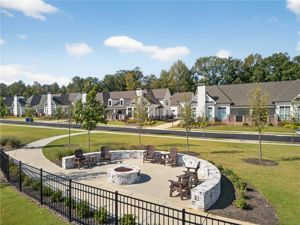 This inviting outdoor space with a fire pit offers a perfect setting for community gatherings.