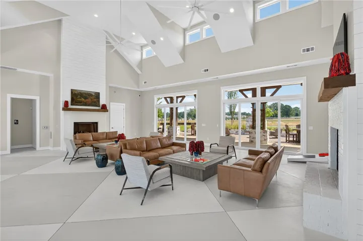 This expansive living area offers soaring ceilings and abundant natural light.